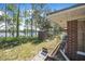 Backyard view of property with storage shed and distant lake views at 2620 Doyle Rd, Deltona, FL 32738
