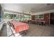 Spacious dining area with tiled floors, well-lit with natural light and featuring views of lush exterior at 2620 Doyle Rd, Deltona, FL 32738