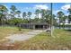 Fenced single story home with a screened in porch and lake views at 2620 Doyle Rd, Deltona, FL 32738