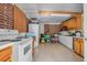 Kitchen featuring updated appliances, tile flooring, and ample countertop space at 2620 Doyle Rd, Deltona, FL 32738