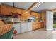 Kitchen featuring updated appliances, tile flooring, and ample countertop space at 2620 Doyle Rd, Deltona, FL 32738