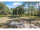 Beautiful lot featuring mature trees, open space, and potential for building your dream home at 2620 Doyle Rd, Deltona, FL 32738