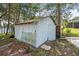 Outdoor shed with tools, providing extra storage space on the property near a lake at 2620 Doyle Rd, Deltona, FL 32738