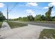 Street view of the sidewalk with lush green trees and foliage at 2620 Doyle Rd, Deltona, FL 32738