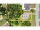 Aerial view of property and large back yard with mature tree canopy at 2633 Yale Rd, South Daytona, FL 32119