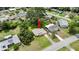 Aerial view of property surrounded by lush landscaping and trees at 2633 Yale Rd, South Daytona, FL 32119
