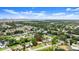 Aerial view of neighborhood, lush landscaping and waterway in distance at 2633 Yale Rd, South Daytona, FL 32119