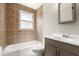 Bathroom with tiled shower over tub and vanity at 2633 Yale Rd, South Daytona, FL 32119
