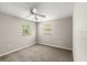 The bedroom has two windows, neutral colors, and carpet at 2633 Yale Rd, South Daytona, FL 32119