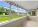 Enclosed sunroom provides ample natural light and views of the outdoors at 2633 Yale Rd, South Daytona, FL 32119
