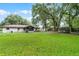 Large, meticulously maintained backyard provides ample space for recreation, gardening, and relaxation at 270 Sandyhook Ln, Deland, FL 32724