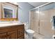 Bathroom featuring wood vanity, sink, toilet, and glass shower with tile floors at 270 Sandyhook Ln, Deland, FL 32724
