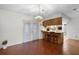 The dining room shows wood floors, breakfast bar and chairs with a view into the kitchen at 270 Sandyhook Ln, Deland, FL 32724