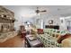 Cozy living room with fireplace, wood flooring, and comfortable seating arrangement at 270 Sandyhook Ln, Deland, FL 32724