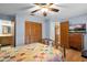 A bright main bedroom featuring a bed, hardwood floors, a closet and blue walls at 270 Sandyhook Ln, Deland, FL 32724