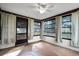 Relaxing sunroom with abundant natural light, neutral color scheme, and ceiling fan at 270 Sandyhook Ln, Deland, FL 32724