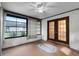 Cozy sunroom with large windows, tile flooring, and access to the backyard at 270 Sandyhook Ln, Deland, FL 32724