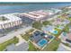 Homes with pools, an extensive condo complex, a bay, and lush landscaping highlight this picturesque aerial perspective at 2724 N Halifax Ave, Daytona Beach, FL 32118