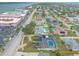 Aerial view featuring homes with pools, a lengthy road, a bay, and a large condo complex and bridge at 2724 N Halifax Ave, Daytona Beach, FL 32118