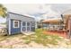 Fully fenced backyard featuring storage shed, covered dining area, and screened in pool at 2724 N Halifax Ave, Daytona Beach, FL 32118
