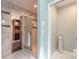 Beautiful bathroom featuring a glass-enclosed shower, elegant vanity and a walk-in closet at 2724 N Halifax Ave, Daytona Beach, FL 32118