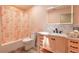 Beautiful bathroom with stylish vanity, decorative shower curtain and wood-look floors at 2724 N Halifax Ave, Daytona Beach, FL 32118