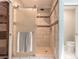 Shower featuring a glass door, white subway tile, and a rainfall showerhead at 2724 N Halifax Ave, Daytona Beach, FL 32118