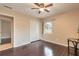 Bright bedroom with hardwood floors, a ceiling fan, and a double door closet at 2724 N Halifax Ave, Daytona Beach, FL 32118