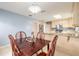Cozy dining area featuring wood table with seating for four, tile floors, and adjacent open kitchen at 2724 N Halifax Ave, Daytona Beach, FL 32118