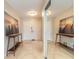 Bright foyer featuring tile flooring, neutral walls, a mirror, and decorative side tables at 2724 N Halifax Ave, Daytona Beach, FL 32118
