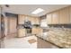 Stylish kitchen featuring granite countertops, stainless steel appliances, and ample cabinet space at 2724 N Halifax Ave, Daytona Beach, FL 32118