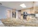 Spacious kitchen featuring granite countertops, stainless steel appliances, and light cabinets at 2724 N Halifax Ave, Daytona Beach, FL 32118