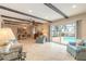 Bright living room boasts a view to the pool, recessed lighting, tiled floors and wooden beams at 2724 N Halifax Ave, Daytona Beach, FL 32118