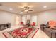 Inviting living room with travertine flooring, a red rug, and ample natural light at 2724 N Halifax Ave, Daytona Beach, FL 32118