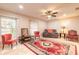 Spacious living room showcases tile flooring, large windows, and a ceiling fan at 2724 N Halifax Ave, Daytona Beach, FL 32118