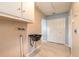 Mud room with utility sink, storage, washer dryer hookups, tile floors and large closet at 2724 N Halifax Ave, Daytona Beach, FL 32118
