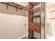 Spacious walk-in closet with custom wood shelving and a built-in drawer for optimal storage solutions at 2724 N Halifax Ave, Daytona Beach, FL 32118