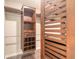 Neatly organized walk-in closet with built-in shelving, hanging rods, and wooden accents at 2724 N Halifax Ave, Daytona Beach, FL 32118