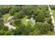 Charming home surrounded by a dense tree canopy with a beautiful private pond at 2950 Ragis Rd, Edgewater, FL 32132