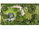 Secluded home nestled on a private lot with lush greenery and a serene pond at 2950 Ragis Rd, Edgewater, FL 32132