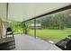Covered patio and well manicured backyard perfect for grilling, outdoor entertainment and relaxation at 2950 Ragis Rd, Edgewater, FL 32132