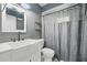 Neutral bathroom featuring updated vanity, lighting, faucet, new floors, toilet and shower/tub at 2950 Ragis Rd, Edgewater, FL 32132