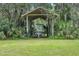 Covered boat storage area surrounded by lush greenery, perfect for protecting your watercraft at 2950 Ragis Rd, Edgewater, FL 32132