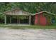 Exterior view of a carport and storage shed, providing covered parking and outdoor storage solutions at 2950 Ragis Rd, Edgewater, FL 32132