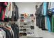 This closet features racks of clothing, and shoe racks to maximize storage in an organized space at 2950 Ragis Rd, Edgewater, FL 32132