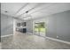 Dining area featuring modern chandelier and a sliding glass door to outdoor patio at 2950 Ragis Rd, Edgewater, FL 32132