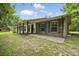 Charming brick home with a long porch, shutters, and well-maintained landscaping at 2950 Ragis Rd, Edgewater, FL 32132