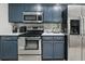 Close up of the kitchen with stainless steel appliances and white countertops at 2950 Ragis Rd, Edgewater, FL 32132