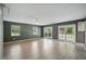 Spacious living room with new flooring and backyard views at 2950 Ragis Rd, Edgewater, FL 32132