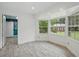 Bright living room with bay windows offering ample natural light and views of the backyard at 2950 Ragis Rd, Edgewater, FL 32132
